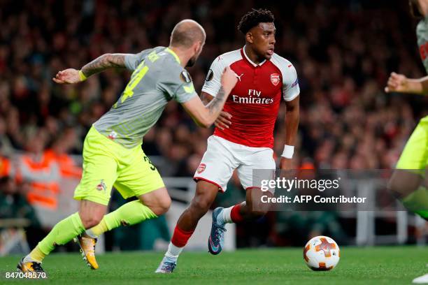 Arsenal's Nigerian striker Alex Iwobi runs with the ball during the UEFA Europa League Group H football match between Arsenal and FC Cologne at The...