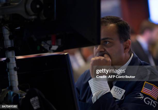 Trader works on the floor at the closing bell of the Dow Industrial Average at the New York Stock Exchange on September 14, 2017 in New York. The Dow...