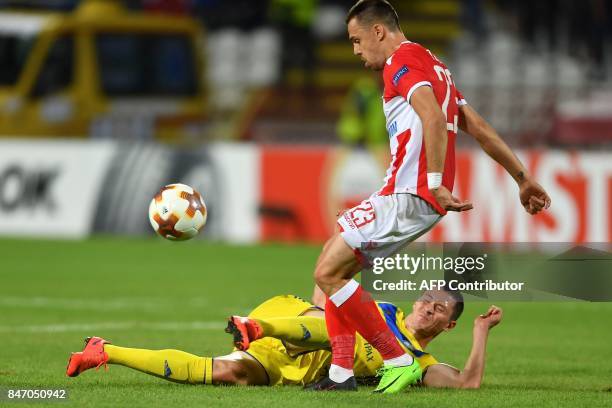 Bate's forward Nikolai Signevich vies with Crvena Zvezda's defender Milan Rodic during the UEFA Europa League match between FK Crvena Zvezda Beograd...