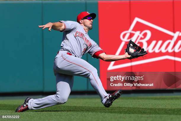 Adam Duvall of the Cincinnati Reds catches a fly ball against the St. Louis Cardinals in the seventh inning at Busch Stadium on September 14, 2017 in...