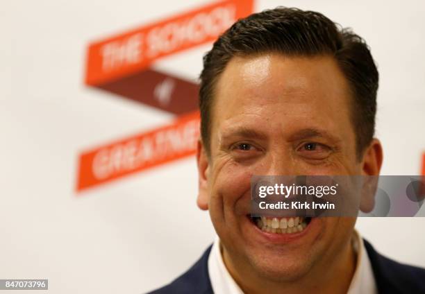 Chris Lee poses for a picture after signing a copy of his book during the Summit of Greatness on September 14, 2017 in Columbus, Ohio.