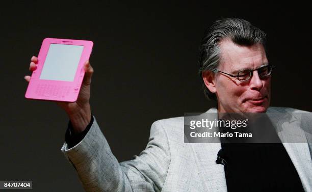 Author Stephen King holds a special pink Kindle given to him by Amazon.com founder and CEO Jeffrey P. Bezos at an unveiling event for the Amazon...