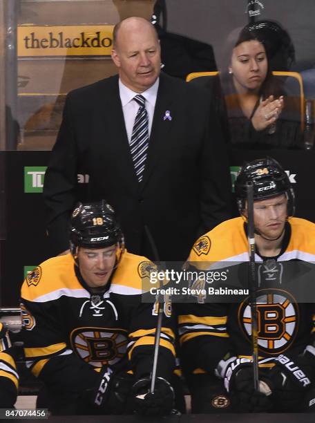 Head coach Claude Julien of the Boston Bruins watch his team play in the game against the Florida Panthers at TD Garden on March 31, 2015 in Boston,...