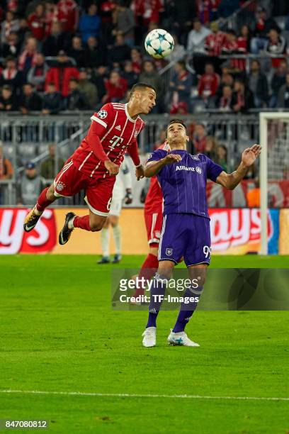 Thiago of Bayern Muenchen and Hamdi Harbaoui of Anderlecht battle for the ball during the UEFA Champions League group B match between Bayern Muenchen...