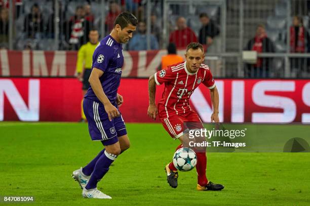 Hamdi Harbaoui of Anderlecht and Rafinha of Bayern Muenchen battle for the ball during the UEFA Champions League group B match between Bayern...