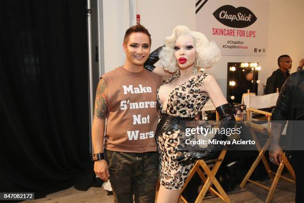 Fashion designer, Michael Kuluva and model Amanda Lepore, pose backstage at the Tumbler And Tipsy By Michael Kuluva fashion show during New York...