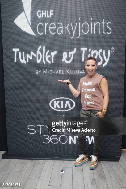 Fashion designer, Michael Kuluva, poses backstage at the Tumbler And Tipsy By Michael Kuluva fashion show during New York Fashion Week: Style360 at...