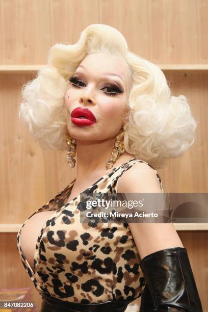 Model Amanda Lepore poses backstage at the Tumbler And Tipsy By Michael Kuluva fashion show during New York Fashion Week: Style360 at Metropolitan...