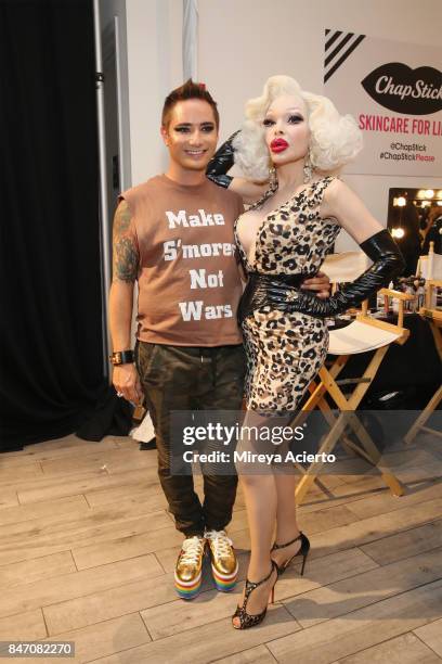 Fashion designer, Michael Kuluva and model Amanda Lepore, pose backstage at the Tumbler And Tipsy By Michael Kuluva fashion show during New York...