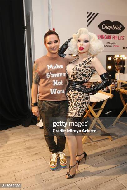 Fashion designer, Michael Kuluva and model Amanda Lepore, pose backstage at the Tumbler And Tipsy By Michael Kuluva fashion show during New York...