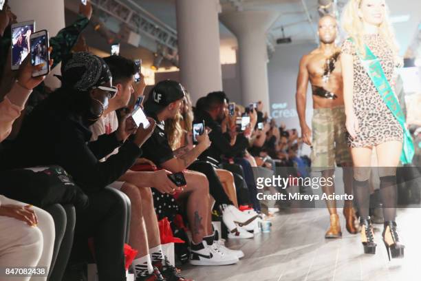 Guests attend, cell phone detail, the Tumbler And Tipsy By Michael Kuluva fashion show during New York Fashion Week: Style360 at Metropolitan...