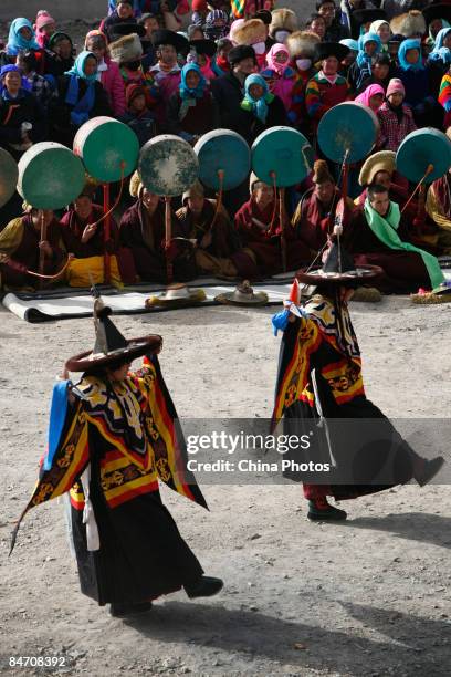 Lamas dance during the "Tiaoqian" praying ceremony at the Youning Temple on February 8, 2009 in Huzhu County of Qinghai Province, China. The Youning...