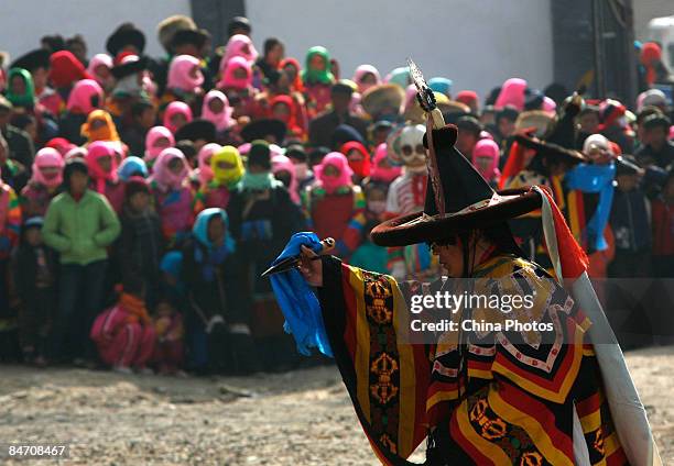 Lama dances during the "Tiaoqian" praying ceremony at the Youning Temple on February 8, 2009 in Huzhu County of Qinghai Province, China. The Youning...