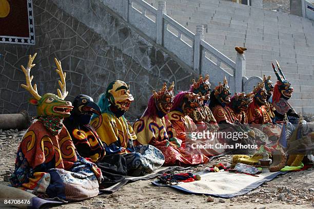Lamas attend the "Tiaoqian" praying ceremony at the Youning Temple on February 8, 2009 in Huzhu County of Qinghai Province, China. The Youning Temple...
