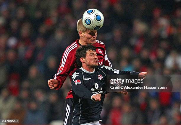 Peter Pechtold of Nuernberg battles for the ball with Dragan Paljic of Kaiserslautern during the Second Bundesliga match between 1. FC Nuernberg and...