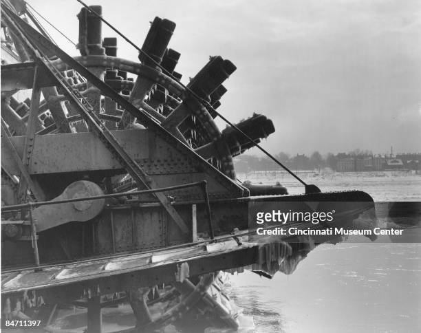 Close-up view oof a paddleboat's wheel covered with ice during winter on the Ohio river, Cincinnati, 1940.