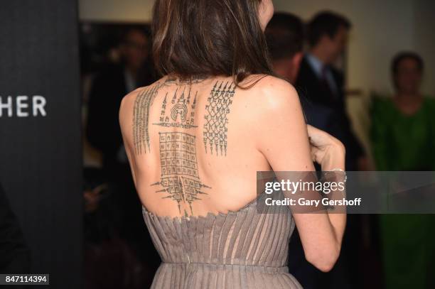 Writer/producer/director Angelina Jolie, tattoo deatail, attends the "First They Killed My Father" New York premiere on September 14, 2017 in New...