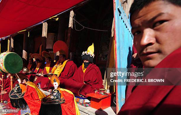 Tibetan Buddhist monks participate in musical activities during Cham dances at ongoing celebrations for Monlam, or the Great Prayer Festival, at the...