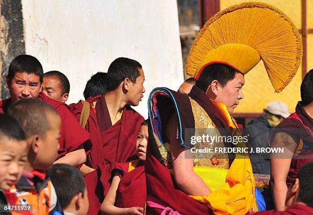 Tibetan Buddhist monks gather during ongoing celebrations for Monlam, or the Great Prayer Festival, at the Nyentog Monastery, also known as Nianduhu...