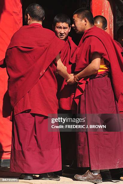 Tibetan Buddhist monks gather during ongoing celebrations for Monlam, or the Great Prayer Festival, at the Nyentog Monastery, also known as Nianduhu,...