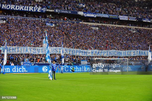 Fans of Schalke with a banner during the Bundesliga match between FC Schalke 04 and VfB Stuttgart at Veltins-Arena on September 10, 2017 in...