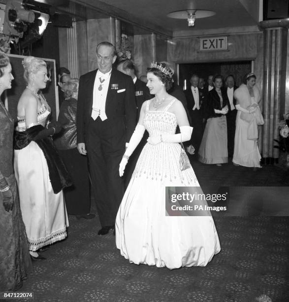 Queen Elizabeth II arriving at the Odeon, Leicester Square, London for the world charity premiere of the film 'Lawrence of Arabia'.