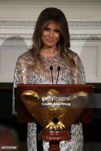 First lady Melania Trump speaks during a reception at the State Dining Room of the White House September 14, 2017 in Washington, DC. President Trump...