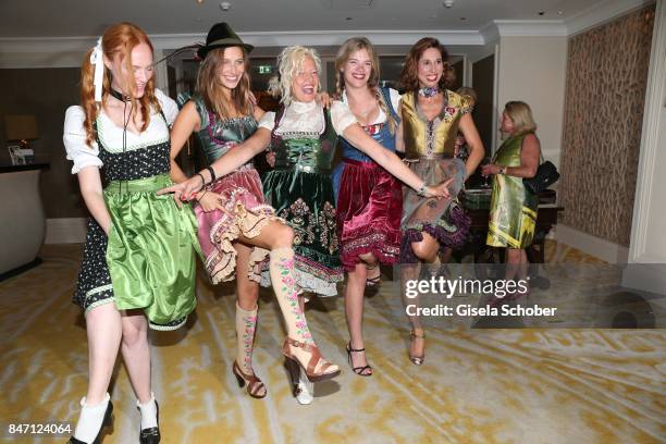 Model Sylvia Flote, Photographer Ellen von Unwerth and Nicole Poturalski and Valeria and Dirndl Fashion designer Lola Paltinger during the 'Ellen von...