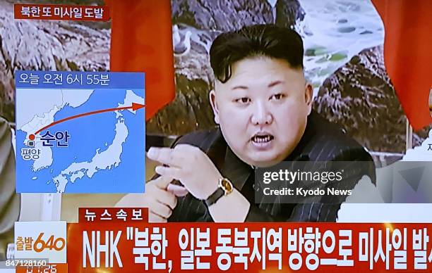 Screen in Seoul shows news of North Korea's launch of a ballistic missile that flew over the northern Japan island of Hokkaido into the Pacific Ocean...