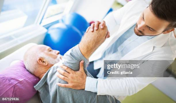 shoulder dislocation. - physiotherapy shoulder stock pictures, royalty-free photos & images