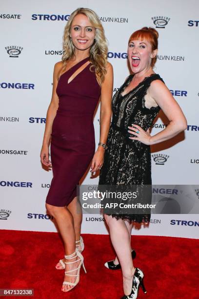 Amy Rutberg and a guest pose as they attend the 'Stronger' New York Premiere at Walter Reade Theater on September 14, 2017 in New York City. / AFP...