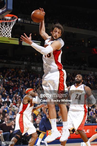Marco Belinelli of the Golden State Warriors rebounds during the game against the Indiana Pacers at Oracle Arena on January 11, 2009 in Oakland,...