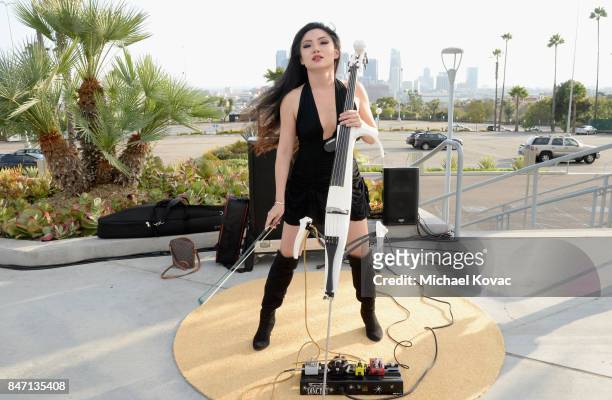 Cellist Tina Guo performs during the Warner Bros. Home Entertainment and Intel presentation of "Wonder Woman in the Sky" at Dodger Stadium on...