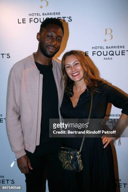 Humorist Thomas N'Gijol and his wife actress Karole Rocher attend the Reopening of the Hotel Barriere Le Fouquet's Paris, decorated by Jacques...