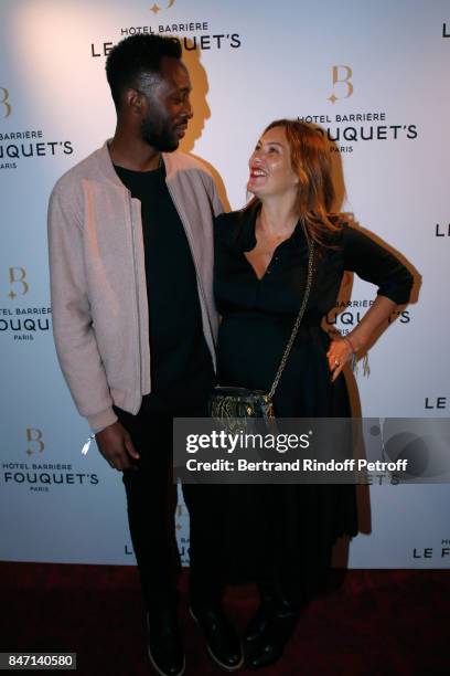 Humorist Thomas N'Gijol and his wife actress Karole Rocher attend the Reopening of the Hotel Barriere Le Fouquet's Paris, decorated by Jacques...