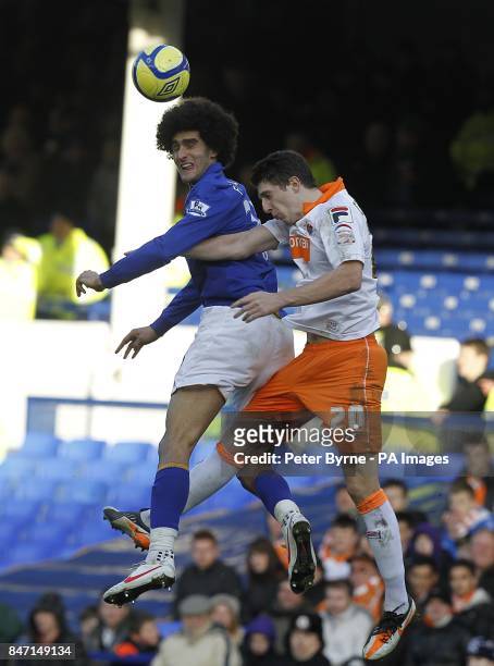 Everton's Marouane Fellaini and Blackpool's Craig Cathcart in action