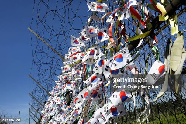 Ribbons wishing for reunification of the two Koreas on the wire fence at the Imjingak Pavilion, near the demilitarized zone of Panmunjom on September...