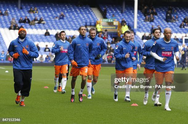 Blackpool players warm up prior to kick off