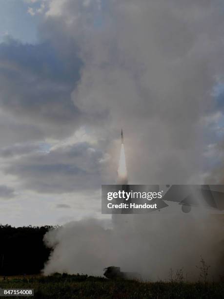 In this handout photo released by the South Korean Defense Ministry, South Korea's missile system firing Hyunmu-2 firing a missile into the East Sea...