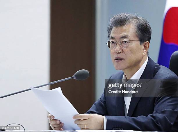 In this handout photo released by the South Korean Presidential Blue House, South Korean President Moon Jae-in speaks as he presides over a meeting...