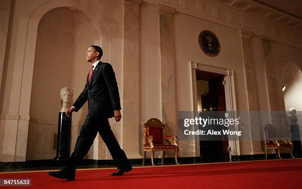 President Barack Obama walks towards the podium for a news conference in the East Room of the White House February 9, 2009 in Washington, DC. Before...