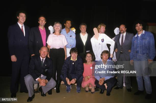 Tennis champion Yannick Noah surrounded by his mother Marie-Claire Noah and celebrities in French TV show 'Tous pour Noah' on April 20, 1986 in...