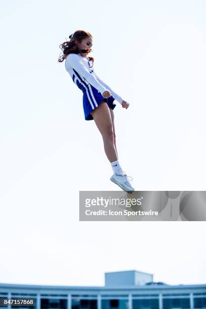Kentucky cheerleader gets tossed into the air before a regular season college football game between the Eastern Kentucky Colonels and the Kentucky...