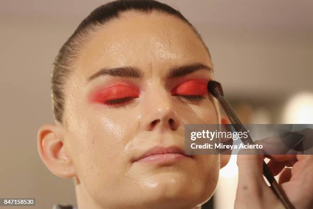 Singer Frida Sundemo prepares backstage at the Livari By Alysia Reiner, Claudine De Sola & Tabitha St. Bernard-Jacobs fashion show during New York...