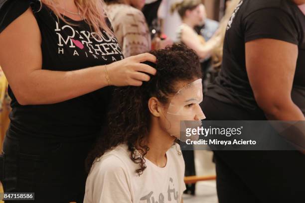 Model prepares backstage at the Livari By Alysia Reiner, Claudine De Sola & Tabitha St. Bernard-Jacobs fashion show during New York Fashion Week:...