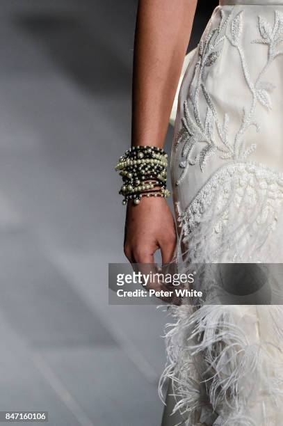 Model, jewelry detail, walks the runway at Marchesa Spring 2018 during New York Fashion Week at Gallery 1, Skylight Clarkson Sq on September 13, 2017...