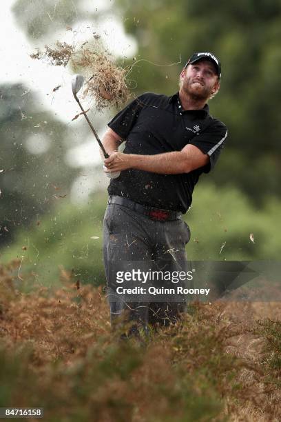 Adam Bland of Australia plays out of the rough on the seventh hole during the Australasia International Final Qualifying for The 2009 Open...