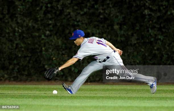 Norichika Aoki of the New York Mets fields a double hit by Anthony Rizzo of the Chicago Cubs during the fourth inning at Wrigley Field on September...