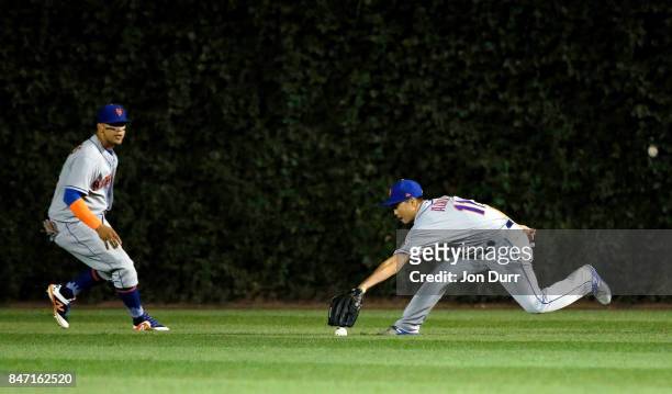 Norichika Aoki of the New York Mets fields a double hit by Anthony Rizzo of the Chicago Cubs during the fourth inning at Wrigley Field on September...