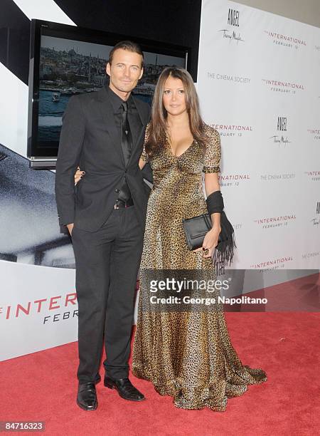 Model Alex Lundqvist and guest attend the Cinema Society and Angel by Thierry Mugler screening of "The International" at AMC Lincoln Square on...